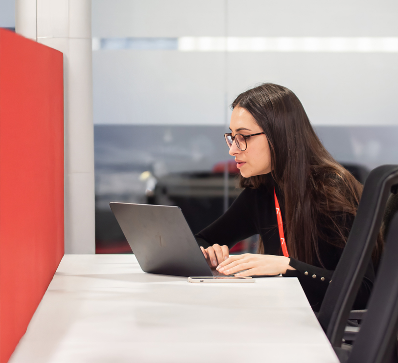 Woman learns code on a laptop