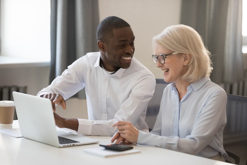 Man and woman sitting at a laptop