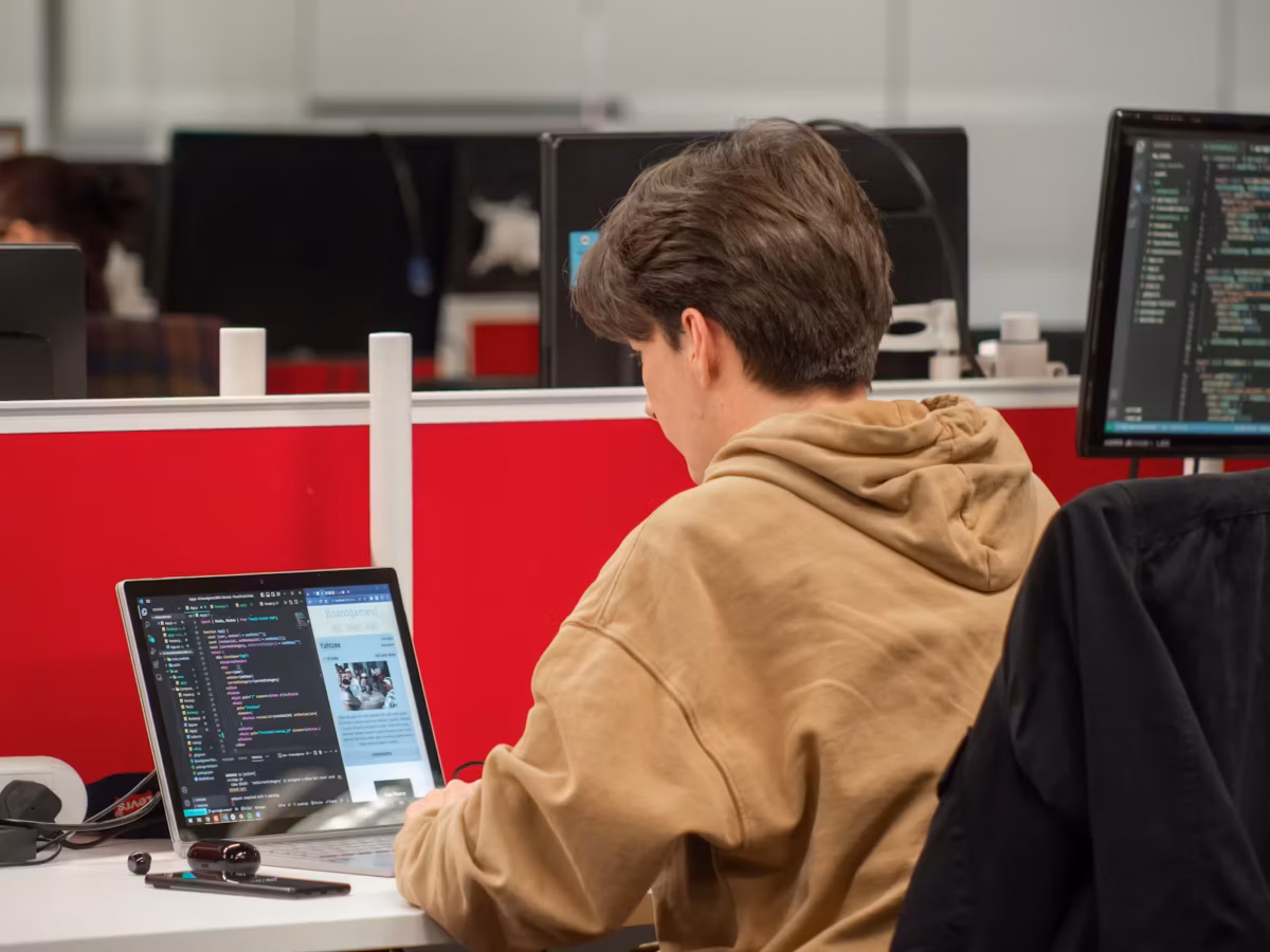 Northcoders student typing code on laptop