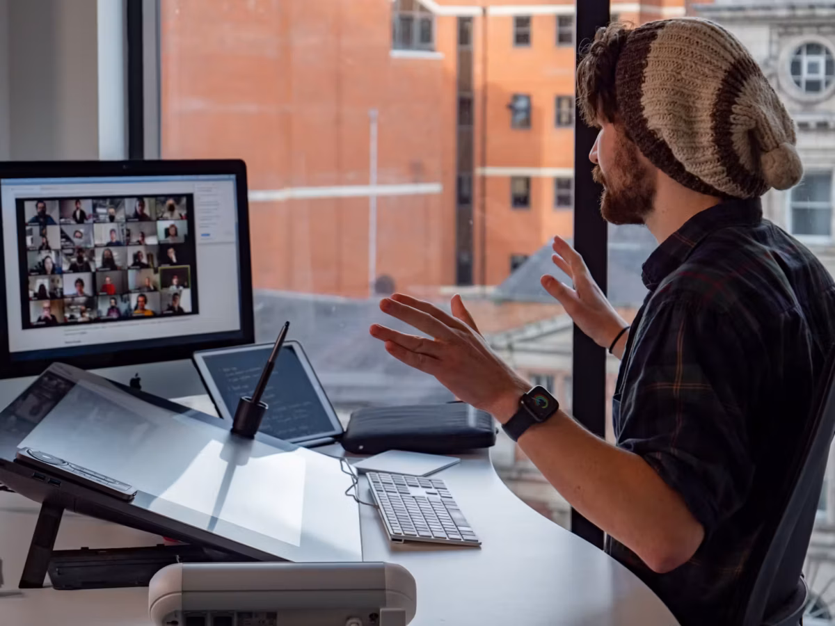 Northcoders tutor teaching an online lecture at his computer on a video call